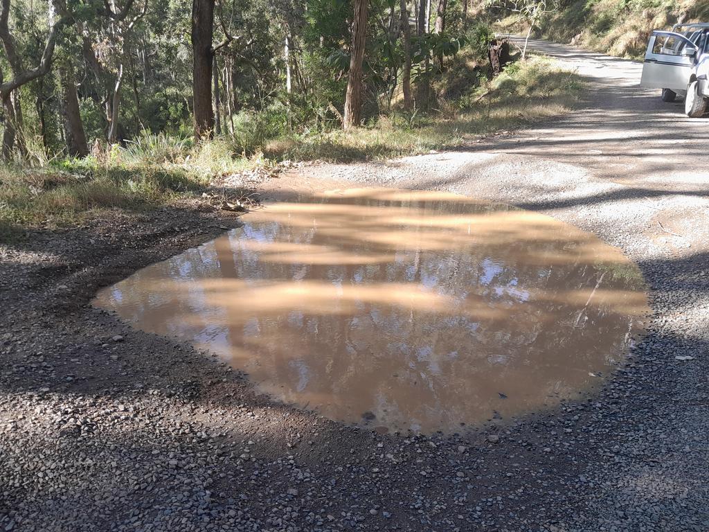 Giant pothole along the steep decent of Condamine River Road. Photo: Brian Thomas