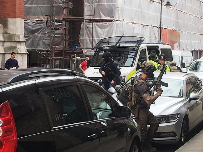 Armed police swoop on Granby House in Manchester. This picture was taken by Louise Bolotin, a freelance journalist who was first on the scene. Picture: @louisebolotin