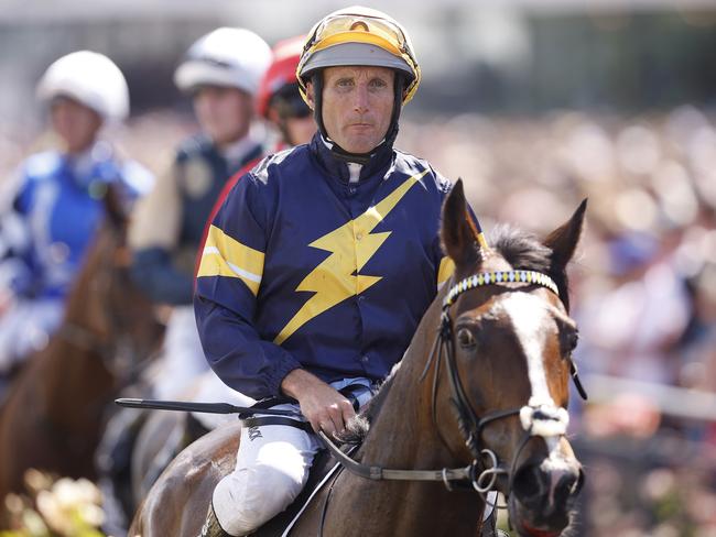 MELBOURNE, AUSTRALIA - NOVEMBER 07: Damien Oliver riding Alenquer returns to the mounting yard after Race 7, The Lexus Melbourne Cupduring Melbourne Cup Day at Flemington Racecourse on November 07, 2023 in Melbourne, Australia. (Photo by Daniel Pockett/Getty Images)