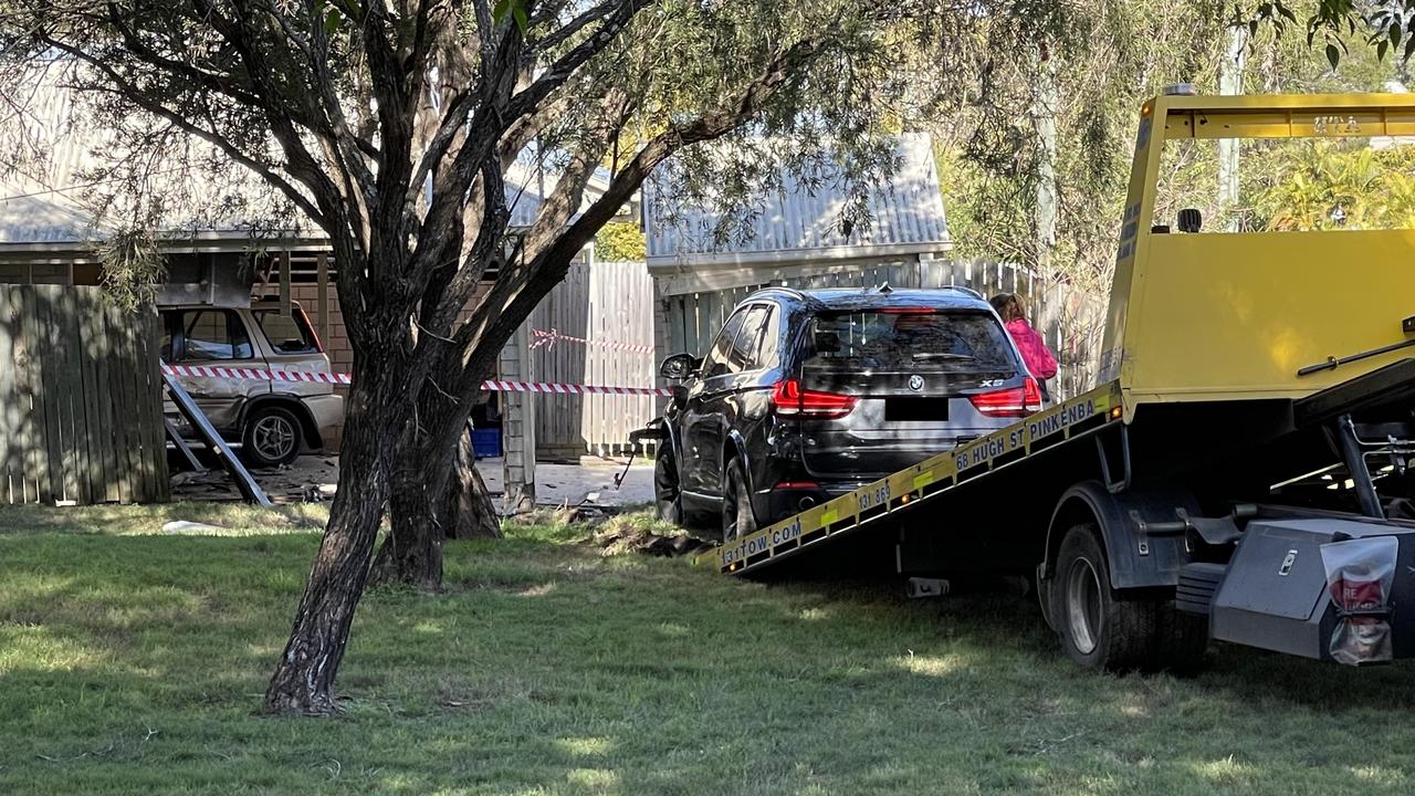 The stolen BMW is removed from the scene. Picture: Matthew Johnston