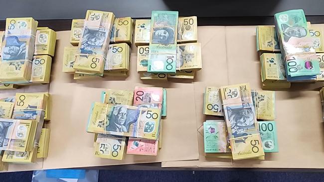 Police found $2million in cash during a raid at Wetherill Park on Thursday Morning. A man will appear in court on Friday. Picture: NSW Police