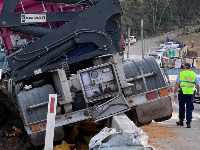 A semi-trailer left Mona Vale Rd at Ingleside and crashed over a concrete safety barrier at a roadworks construction zone. Picture: Ingleside RFS