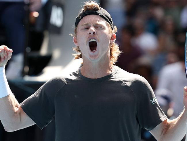 Australia's Dane Sweeny reacts after winning the fourth set against against Argentina's Francisco Cerundolo during their men's singles match on day one of the Australian Open tennis tournament in Melbourne on January 14, 2024. (Photo by Martin KEEP / AFP) / -- IMAGE RESTRICTED TO EDITORIAL USE - STRICTLY NO COMMERCIAL USE --