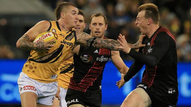 Dustin Martin fends off Brendon Goddard. Picture: Wayne Ludbey