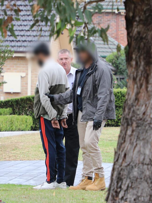 One of three men (left) Cybercrime Squad detectives arrested. Picture: NSW Police