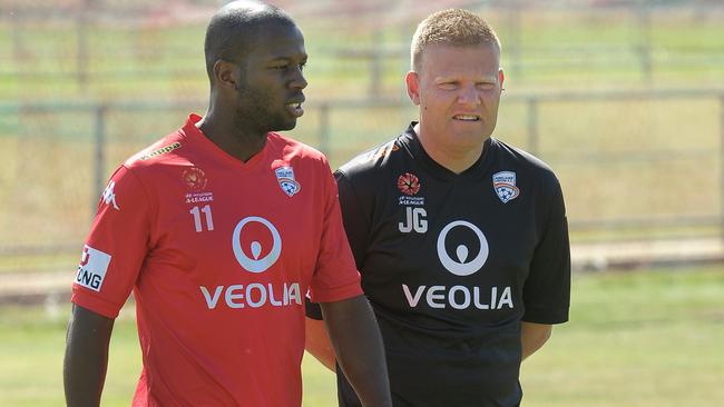 Bruce Djite with then Adelaide United coach Josep Gombau. Picture: Nicholas Wrankmore