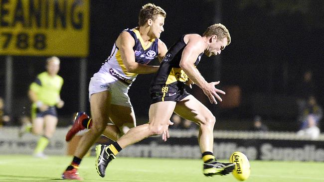 Adelaide's Hamish Latchford tackles Glenelg's Andrew Bradley in Round 2 of the SANFL. Picture: Bianca De Marchi