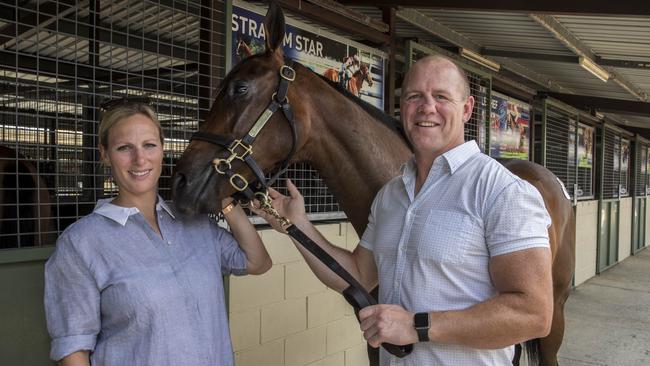 Mike Tindall and his wife Zara Phillips pose for a photograph beside Tindall who sold for $170000 at the Magic Millions Yearling Sales at the Gold Coast last year (AAP Image/Glenn Hunt)