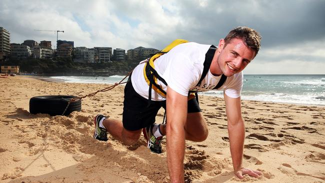Dean Mumm trains at Manly Beach in preparation for his trek to the North Pole.