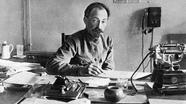 Felix Dzerzhinsky head of the Soviet secret police the Cheka in his office in about 1918. Public domain