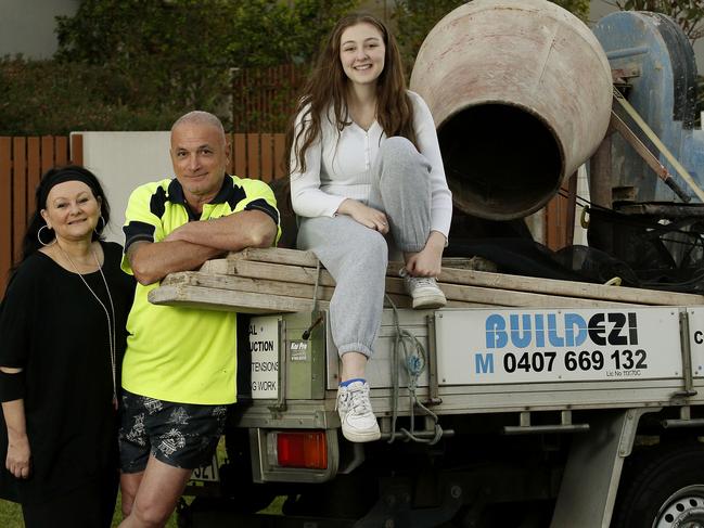 Ross Parillo (centre) with his partner Rosie and daughter Ellie -17. Ross is a brickie who would consider moving to Qld for work. He is one of the rising number of tradies ready to pack up and move just when we need construction staff more than ever. Picture: John Appleyard