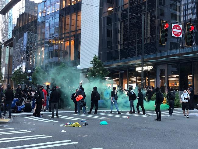 Demonstrators gather at 5th Avenue and Madison Street during a march in solidarity with Minneapolis and protesting police brutality in Seattle. Picture: AP