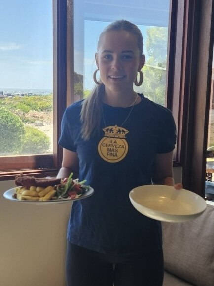 Marion Bay Tavern Marion Bay Tavern's Leila Wood with a schnitzel and cut down serve of chips. Picture: Supplied