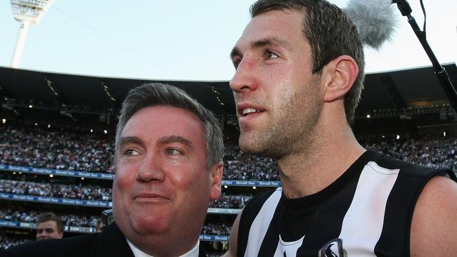 Eddie McGuire and Travis Cloke celebrate Collingwood winning the 2010 AFL Grand Final replay against St Kilda.