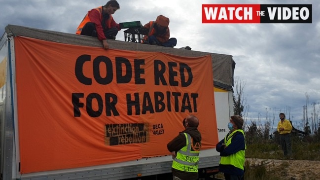 Extinction Rebellion members block road to the Eden chip mill 