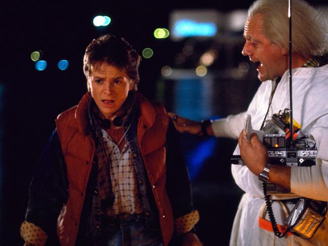 This photo released by Universal Pictures shows, Michael J. Fox, left, as Marty McFly, and Christopher Lloyd as Dr. Emmett Brown, in a scene from the 1985 film, "Back to the Future." Co-stars Lea Thompson, Lloyd and others gather on Tuesday, June 30, 2015, for a special screening of the 1985 Michael J. Fox time-travel blockbuster, to be presented on the massive Hollywood Bowl screen with musical score performed live and orchestra conducted by the original composer, Alan Silvestri. (Universal Pictures via AP)