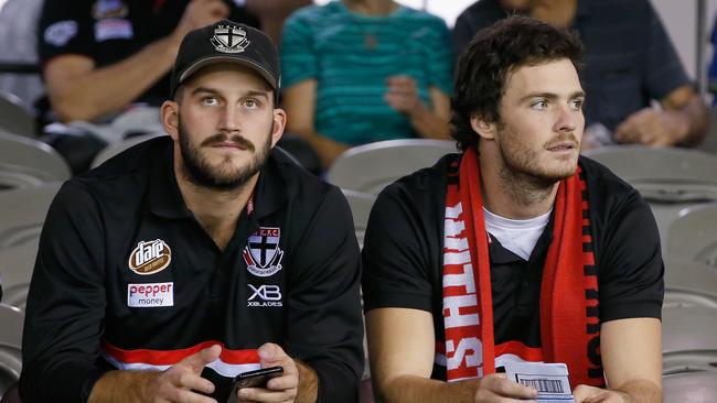 Dylan Roberton, right, and injured St Kilda teammate Josh Bruce watch the Saints play the Giants at Etihad Stadium last month. Picture: Getty Images