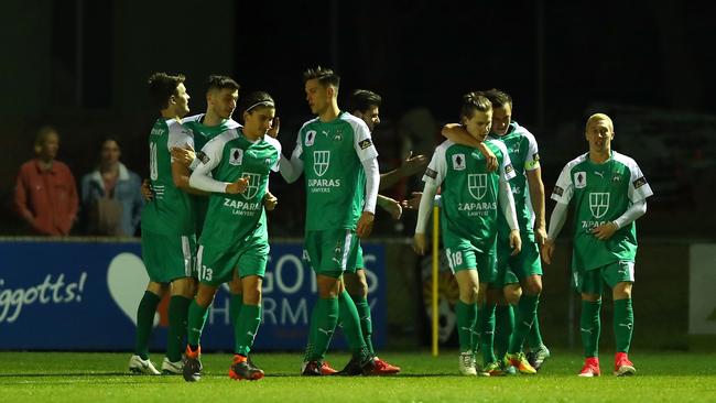 Bentleigh players celebrate another goal.