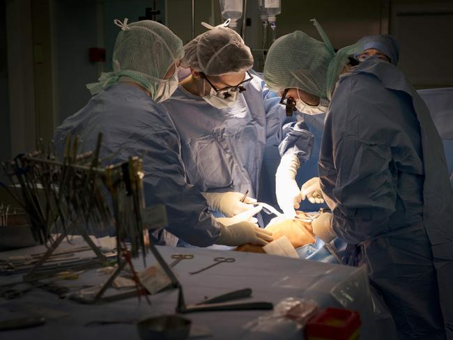 In this photograph taken on December 18, 2017, seven year old French child Anais, undergoes heart surgery to cure a congenital Atrial septal defect, at an operating theatre at The Marie Lannelongue Hospital at Le Plessis-Robinson south of Paris.   The intervention is being undertaken by a Pediatric Cardiothoracic Surgery team of the hospital in Le Plessis-Robinson which specialises in thoracic and cardiovascular surgeries, and congenital heart diseases.  / AFP PHOTO / THOMAS SAMSON