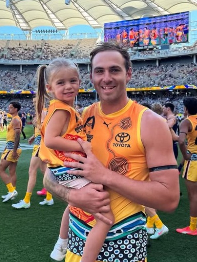 Jeremy Finlayson with daughter Sophia at the AFL Indigenous All Stars Game. Photo: Instagram.