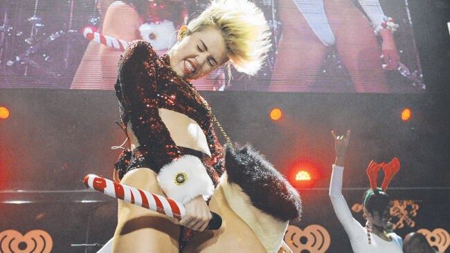 Miley Cyrus performing during the KIIS-FM Jingle Ball concert at Staples Center in Los Angeles. Photo by Chris Pizzello/Invision/AP, File