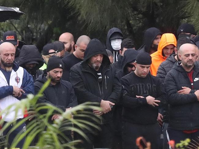 Salim Aschna (seen wearing a black 'Bulls' jumper second from right) attended the funeral of Omar Zahed, the brother of bikie boss Tarek Zahed.