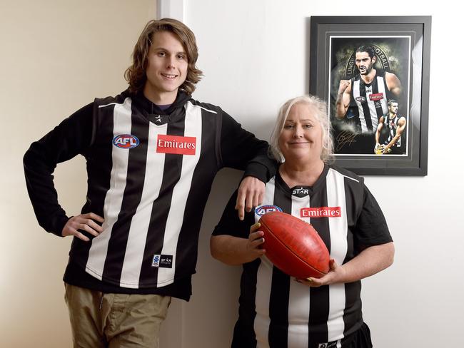 Jenn Palmer, mother of Collingwood ruckman Brodie Grundy (framed behind) photographed with her youngest son Riley, 18, ahead of last year’s AFL grand final. Riley has since also been drafted to the AFL, but by Port Adelaide. Picture: Naomi Jellicoe