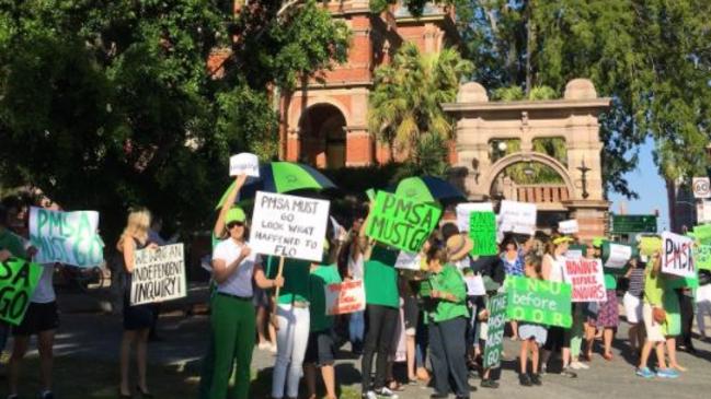 Parents stage a protest outside Somerville House at South Brisbane.