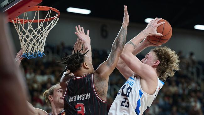 Luke Travers and his Melbourne United teammates are holds. Picture: Brett Hemmings/Getty Images