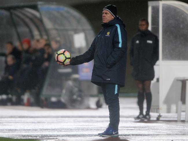 Alen Stajcic stands out in the elements. Pic: Getty Images