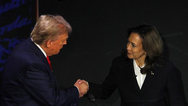 Republican presidential nominee, former U.S. President Donald Trump and Democratic presidential nominee, U.S. Vice President Kamala Harris shake hands as they arrive at their podiums to attend a presidential debate hosted by ABC in Philadelphia. Picture: Reuters/Brian Snyder