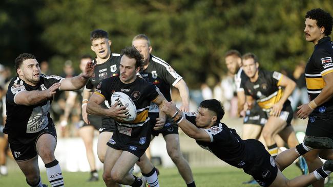 Matraville's Joshua Natoli tries to evade the defence. Picture: John Appleyard