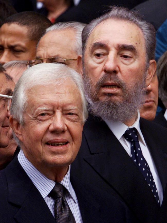 Jimmy Carter and Cuban President Fidel Castro in 2000 at the funeral for Pierre Trudeau in Montreal.