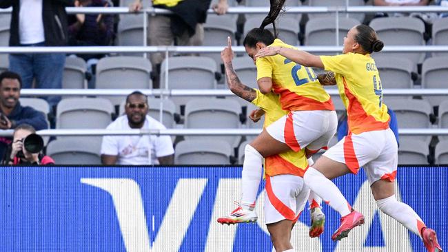 SAN DIEGO, CALIFORNIA - FEBRUARY 26: Marcela Restrepo #8 of Columbia, Sara Sofia Restrepo #20 of Columbia and Ana GuzmÃ¡n #4 of Columbia celebrate a goal during the first half against Australia during the 2025 SheBelieves Cup match between Australia and Colombia at Snapdragon Stadium on February 26, 2025 in San Diego, California.   Orlando Ramirez/Getty Images/AFP (Photo by Orlando Ramirez / GETTY IMAGES NORTH AMERICA / Getty Images via AFP)