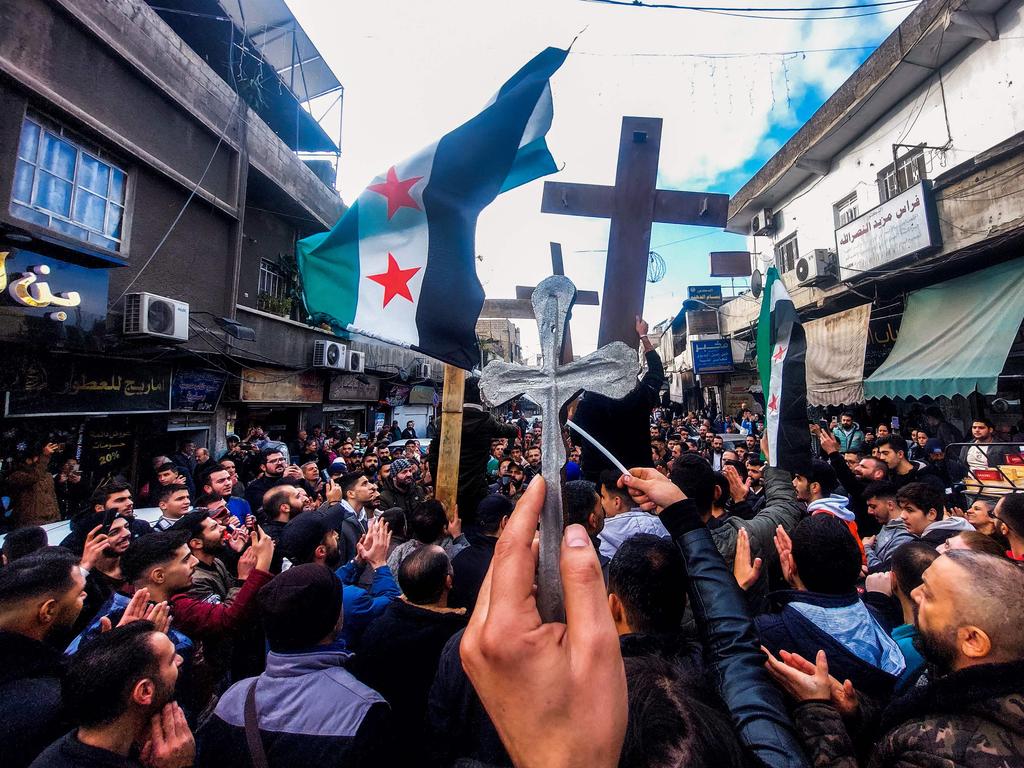 The Christmas tree burning sparked protests in Syria. Picture: AFP