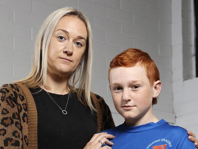 Mums are backing the NRL's stance on head high tackles, pleading with the game's elite not to back down and to ignore the doubters. Engadine Dragons player Coby Kiellor, 12, with his mum Beck Kiellor at the Dragons clubhouse in Engadine. Picture: Jonathan Ng