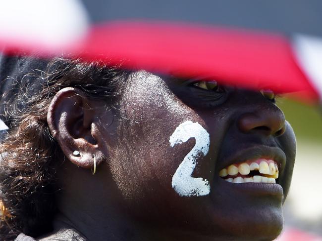 Muluwurri Magpies fans cheer on their team against Tuyu Buffaloes in the Tiwi Islands Football League grand final on Bathurst Island. PICTURE: Elise Derwin