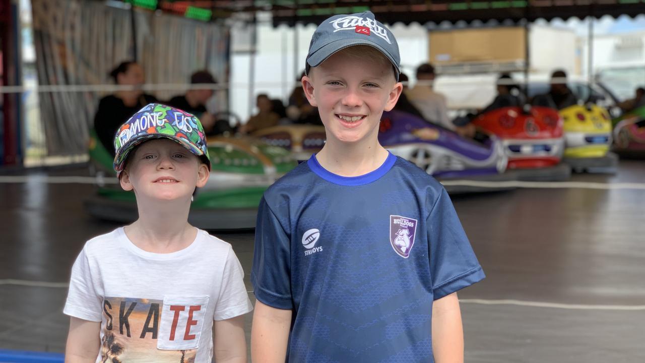 Nate (left) and Isaac Lucas stand by the dodge 'em cars at the Mackay Show on June 16. Picture: Duncan Evans