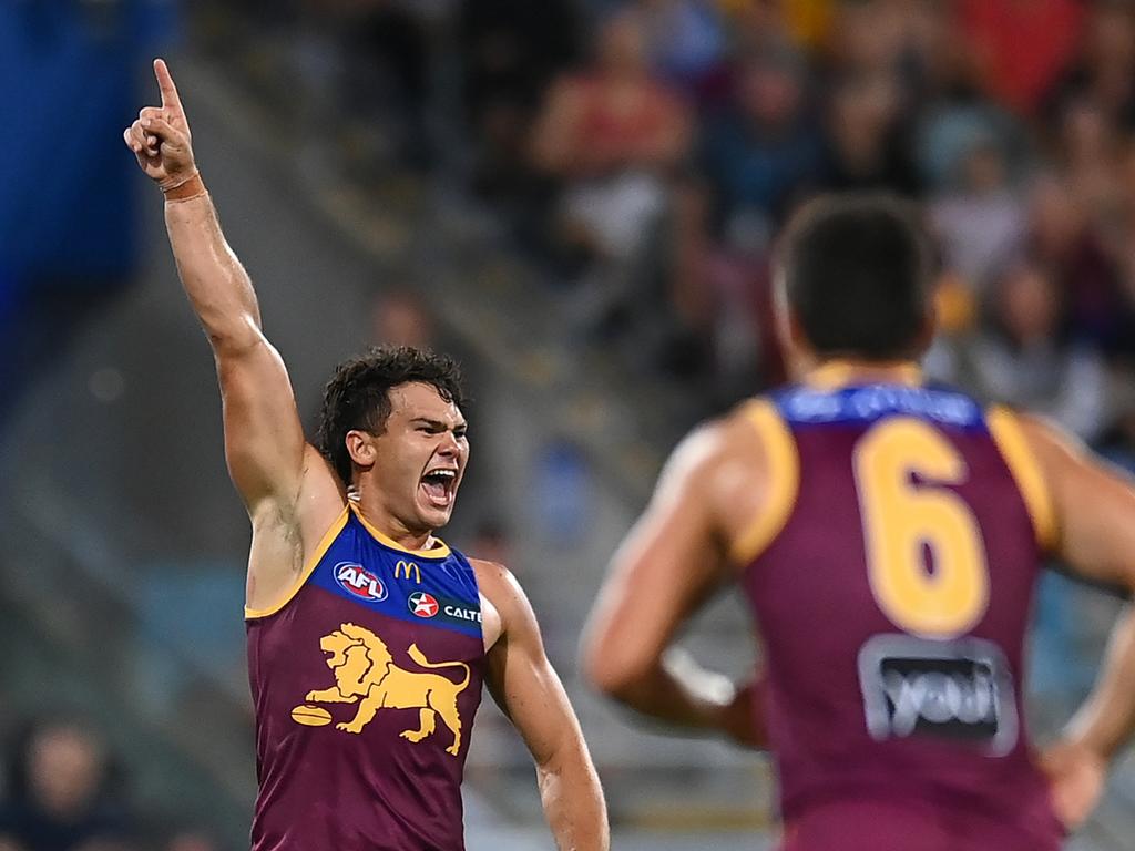 Cam Rayner celebrates a first-half goal for the Lions. Picture: Albert Perez/AFL Photos via Getty Images