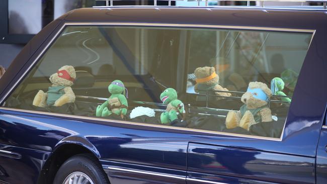 Slater’s favourite toys adorn the hearse. Picture: Glenn Hampson.