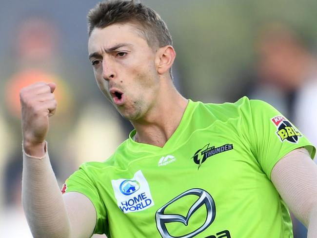 HOBART, AUSTRALIA - JANUARY 24: Daniel Sams of the Thunder celebrates the wicket of Mac Wright of the Hurricanes during the Big Bash League match between the Hobart Hurricanes and the Sydney Thunder at Blundstone Arena on January 24, 2020 in Hobart, Australia. (Photo by Steve Bell/Getty Images)