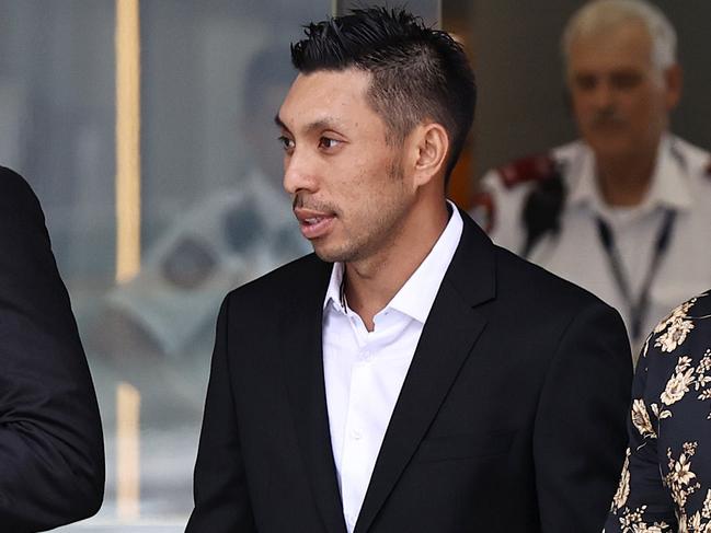 Lam Quoc ÃChopsÃ Ta (centre), a convicted drug trafficker and co-accused of lawyer Adam Magill, leaving Brisbane Supreme & District Court. Pics Tara Croser.