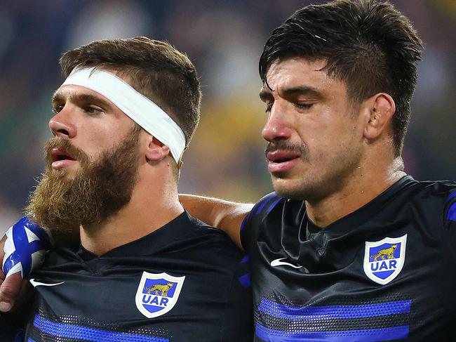 Argentina's captain Julian Montoya (L) sings national anthem with teammates before the Rugby Championship match against Australia in Townsville on September 25, 2021. (Photo by Patrick HAMILTON / AFP) / -- IMAGE RESTRICTED TO EDITORIAL USE - STRICTLY NO COMMERCIAL USE --