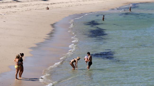 Warm weather in Adelaide will likely see people flock to major beaches. Picture: Kelly Barnes