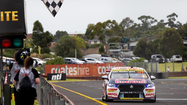 Van Gisbergen in the #97 Red Bull Ampol Holden Commodore ZB takes the checkered flag.