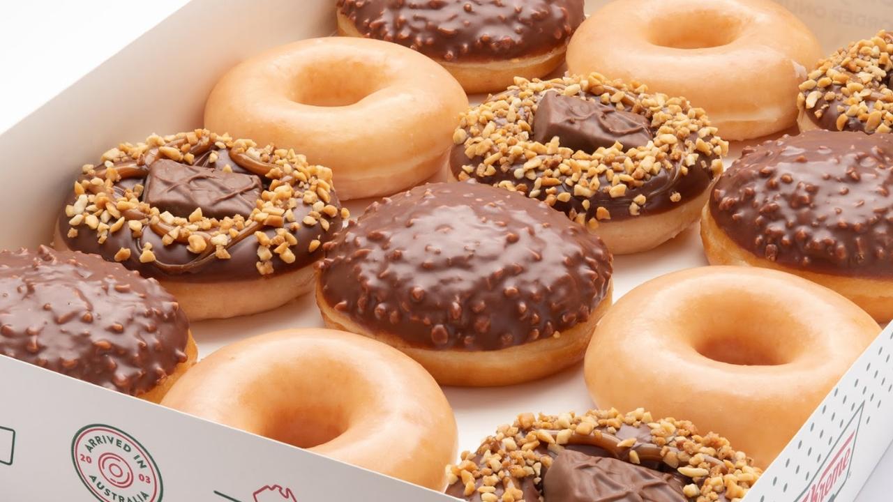 Krispy Kreme collaborates with Snickers to release two new doughnuts.