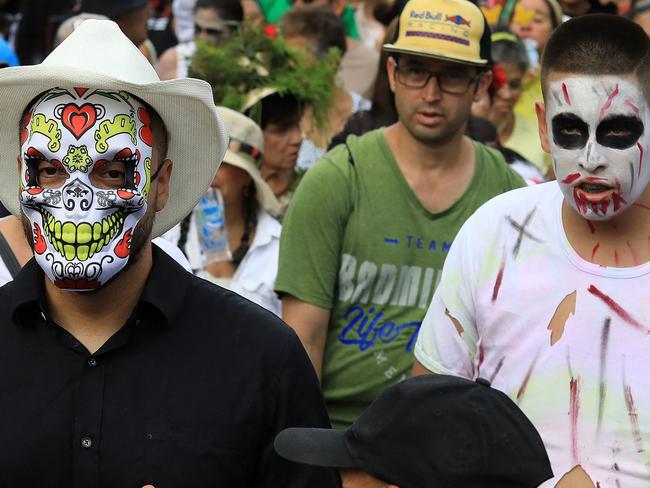 People wearing costumes attend a costume parade as part of Halloween celebrations in Medellin, Colombia on October 29, 2024. (Photo by JAIME SALDARRIAGA / AFP)