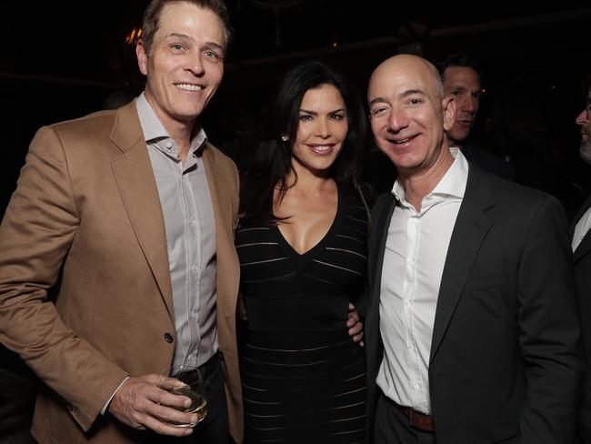 WME's Patrick Whitesell, Lauren Sanchez and Jeff Bezos attend Jeff Bezos and Matt Damon's "Manchester By The Sea" Holiday Party on December 3, 2016. Picture: Getty for Amazon Studios