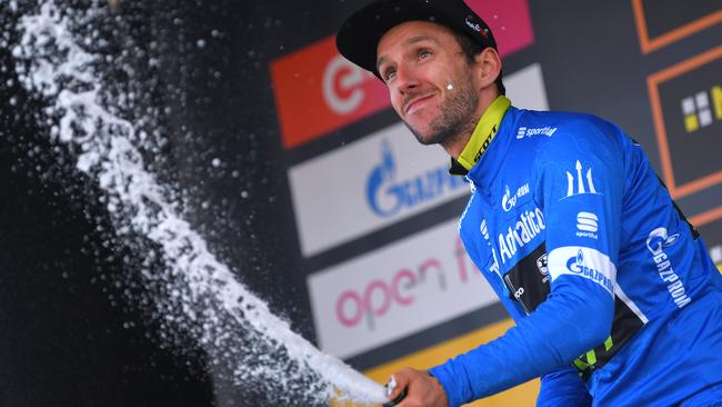 Adam Yates is presented with the blue leaders jersey at Tirreno-Adriatico.