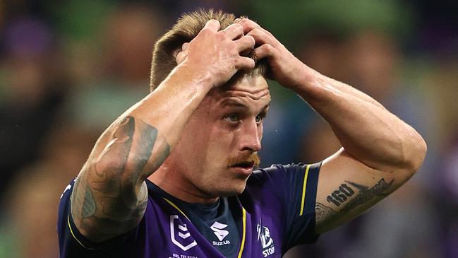 MELBOURNE, AUSTRALIA - APRIL 30:  Cameron Munster of the Storm reacts after missing a conversion during the round eight NRL match between the Melbourne Storm and the Cronulla Sharks at AAMI Park on April 30, 2021, in Melbourne, Australia. (Photo by Robert Cianflone/Getty Images)